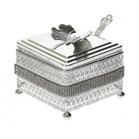 Glass sugar bowl with a diamond-shaped metal holder and a spoon