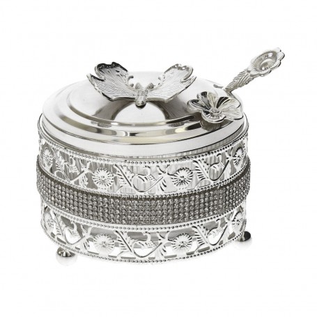 Glass sugar bowl with a diamond-shaped metal holder and a spoon