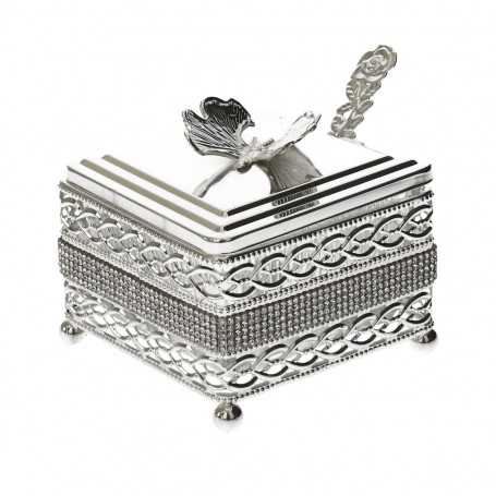 Glass sugar bowl with a diamond-shaped metal holder and a spoon